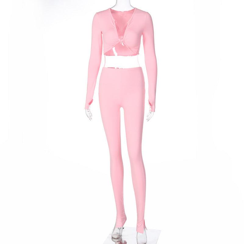 Women in Pink featuring a Long Sleeve Crop Top and Leggings Perfect for a stylish and comfortable summer look Ideal for jogging or casual outings Elevate your style with this matching set